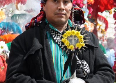 Alcalde of the Cofradía of Santa Cruz, Good Friday, Panajachel. However, during the week he drives tuc tuc (moto-taxi).