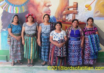 Group of women with public art of San Juan la Laguna