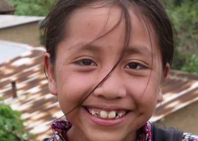 This girl from Patzutzún just left school and is therefore happy.