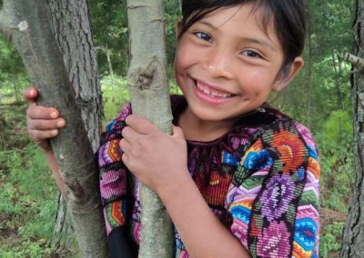 This young girl is happy to live in the Victoria, San Andrés Semetabaj. A few weeks earlier, however, she had seen the complete destruction of her birth place Panimaché Tercero, Chichicastenango at the hands of Tropical Storm Agatha.