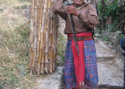 Don Gaspar carrying cane, to his house in Santa Catarina Palopó. Before, they constructed many homes of cane, but today cane´s use is mostly for fencing.