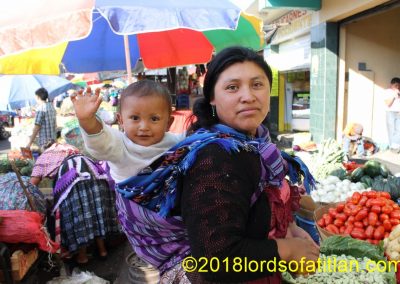 Eddy is big now, but here he is on the back of his mother, a vegetable vendor from Xecaracoj, an aldea of Xela.