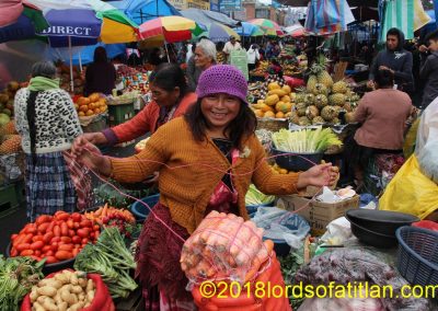 Normally in La Democracia all of the sales are on the side of the street to allow passage to vehicles. However, in the weeks before Christmas, Gloria and others crowd the street with their products.