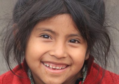 This flower girl from Las Majadas is desperately poor but always smiling and adorable.