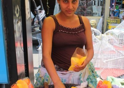 Norma from San Sebastián sells fruit in Xela. Meanwhile, her sister Noemi sells in San Pedro la Laguna..